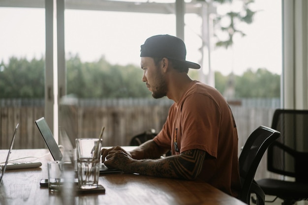 Professional working at a computer in a modern workspace, building an application