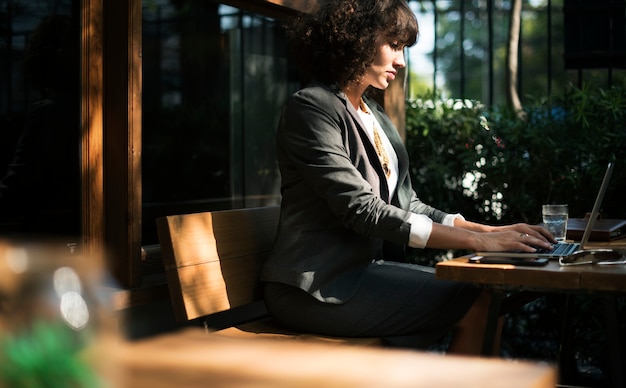 Entrepreneur working at a laptop, reviewing a newly created application