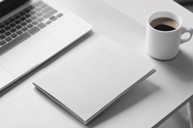 A printed brochure next to a laptop displaying a polished website